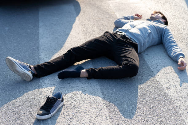 istock Caucasian white man hit by a car on a crosswalk 1208826069