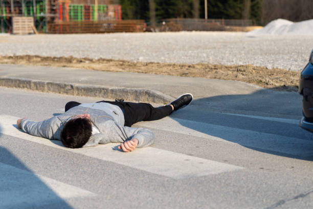 istock Caucasian white man hit by a car on a crosswalk 1208826085