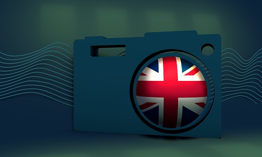 Illustration of photo camera icon with flag of the United Kingdom. Travel and photography concept. 3D rendering