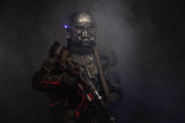 istock Cyborg with weapon in mist and smoke 1208830700