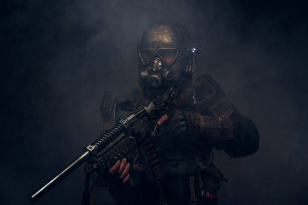 istock Cyborg with weapon in mist and smoke 1208830735