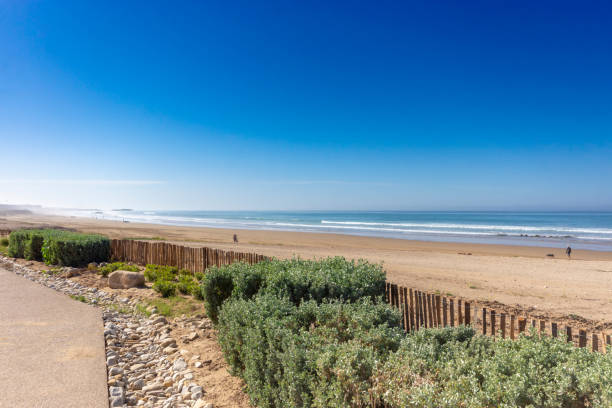 The Sea at Taghazout, Morocco Atlantic Ocean at Taghazout, a tourist area in Morocco that is receiving considerable investment in new hotels, apartments etc. sunset agadir marocco stock pictures, royalty-free photos & images