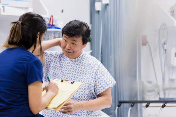 istock Senior man explains symptoms to emergency room doctor 1208837422
