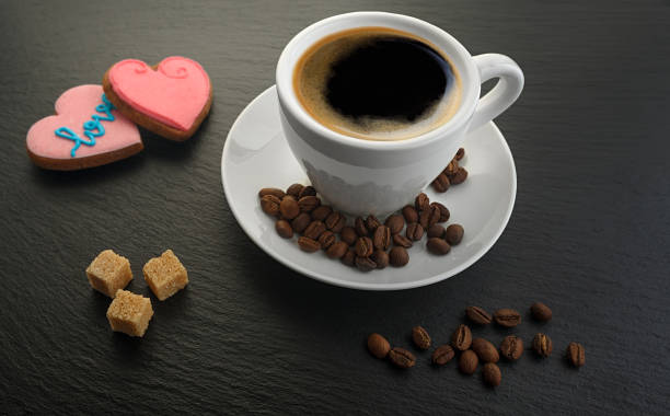 istock white cup with coffee and coffee grains cookies on black slate blackboard 1208837863