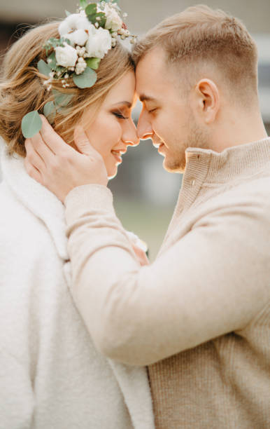 istock Newlyweds stand and embrace. 1208838223