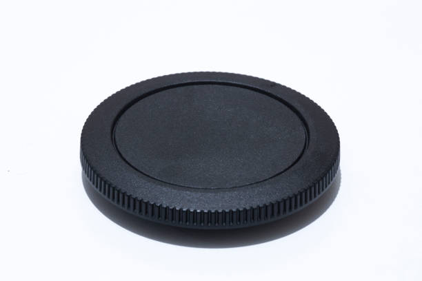 istock Camera body cap close-up. In white background. 1208838532