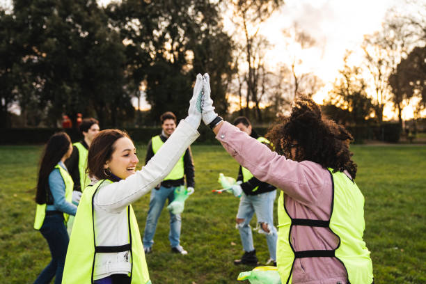 istock Two adolescent volunteers high five together 1208839761