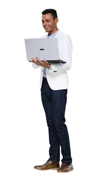istock African-american ethnicity young male standing in front of white background wearing blazer and using computer 1208840929