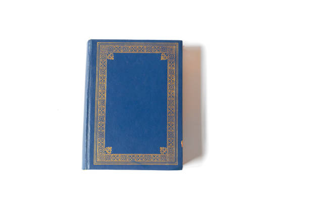 istock Single blue book isolated on white background. View from above 1208841005