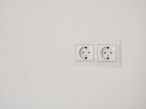 istock Modern white double socket on the wall. Household electrical equipment. 1208842748