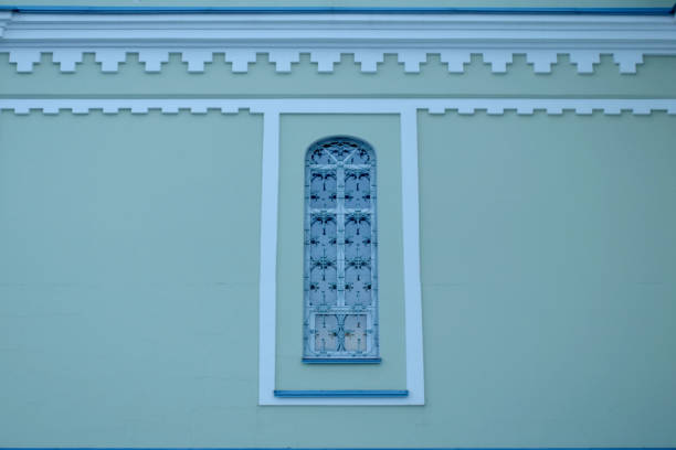istock Tall and narrow window in a wrought-iron church. 1208842810