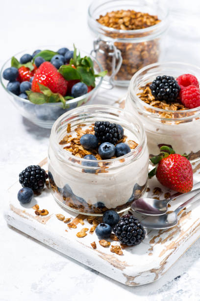 istock healthy creamy dessert with fresh berries, vertical 1208843535