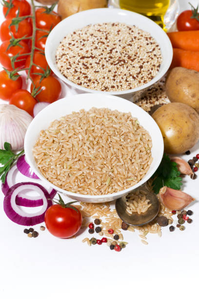 istock brown rice and quinoa and ingredients for soup, vertical top view 1208844769