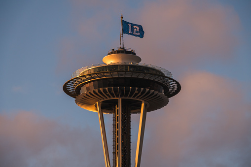 Seattle, Jan 12, 2020: The Seattle Space Needle flying the 12th fan Seahawks flag late in the day.