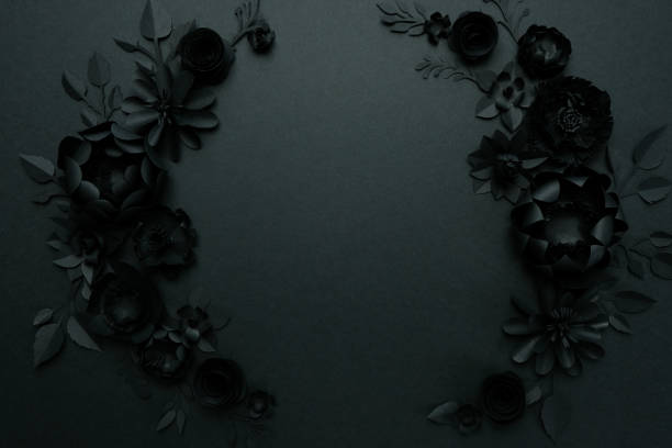 istock Black paper flowers on Black background. Cut from paper. 1208848868