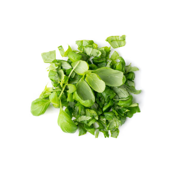 istock Fresh Green Chopped Basil Leaves Isolated on White Background 1208849859