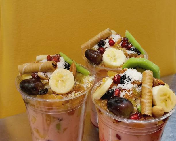 istock Fruit salad with ice cream with honey and nuts 1208850759