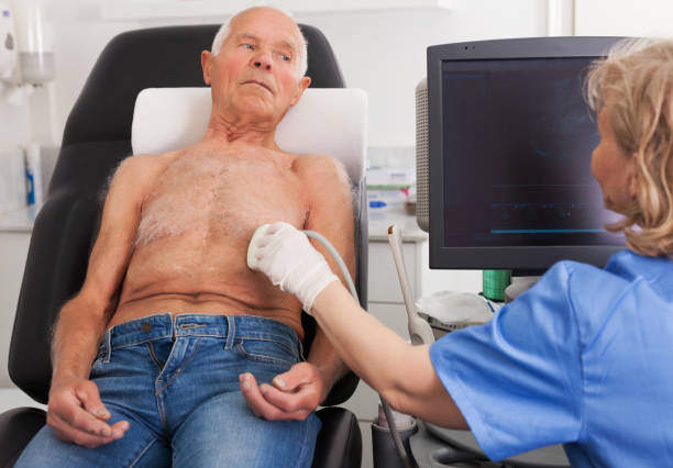 istock doctor examines a senior man  with ultrasonic  device 1208851079