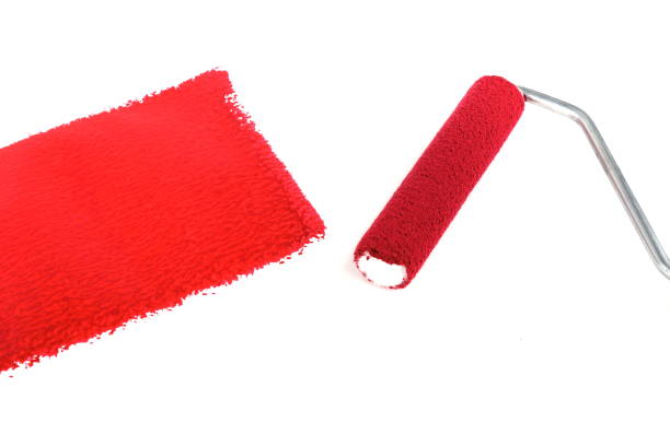istock red paint and painting roller 1208852710