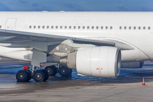 istock Side view of an airplane engine chassis and fuselage. 1208853530