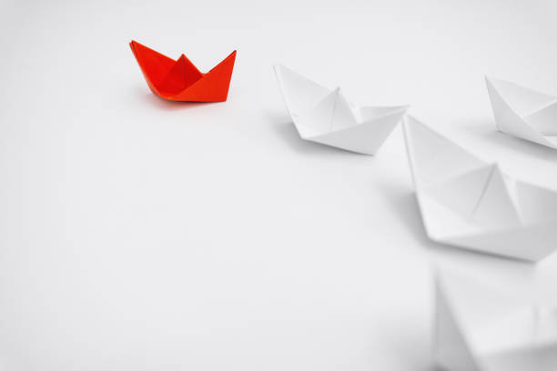 Leadership. Unique Paper Boat Leading The Rest. stock photo