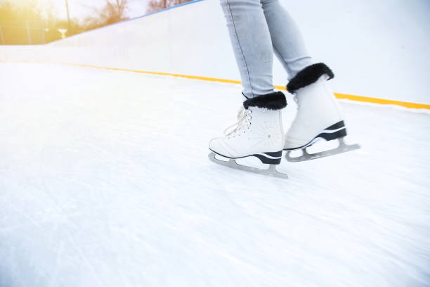 istock woman is ice skating on rink 1208855797