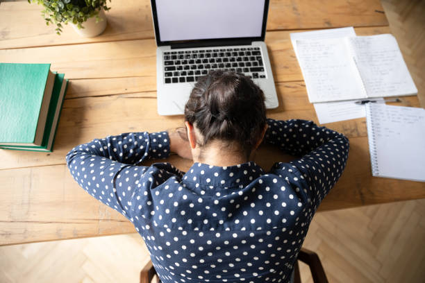 istock Tired girl fall asleep studying at home workplace 1208856028