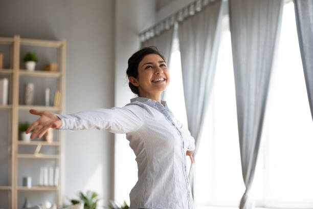 istock Overjoyed ethnic girl have fun dancing at home 1208856052