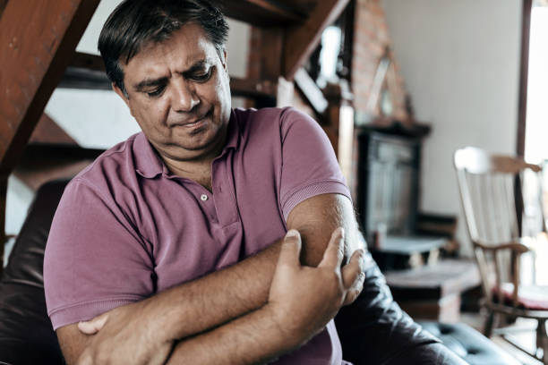 Man elbow pain. Man suffering from pain and rheumatism Man feeling elbow pain, sport injury, chronic rheumatism, health problem rough hands man stock pictures, royalty-free photos & images