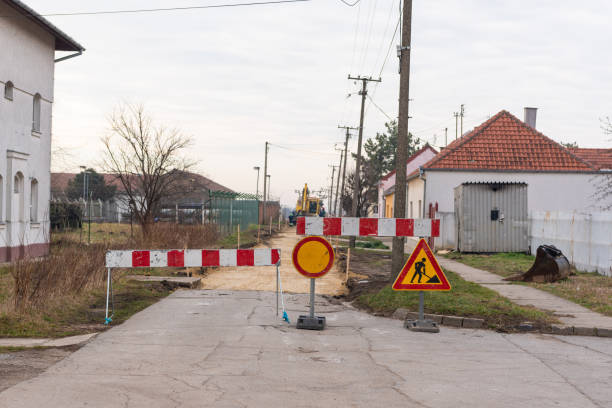 istock Workers with machinery preparing the road for new asphalt 1208858507