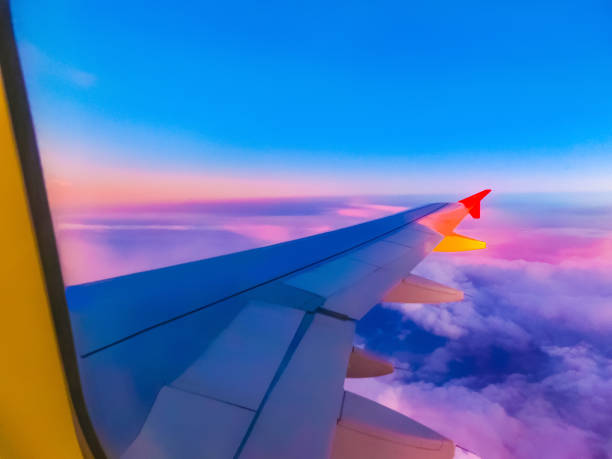 istock View from an airplane on a blue sky and white clouds. 1208861827