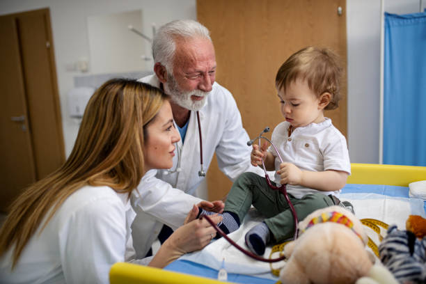 istock Doctor examining baby boy with stethoscope 1208863928