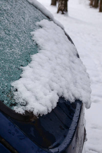 istock Ice and snow on a parked car in winter 1208864055