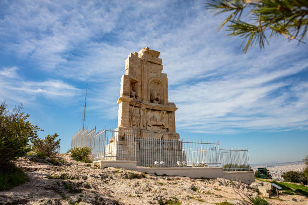 Philopappos Monument, blue sky background. Athens, Greece,