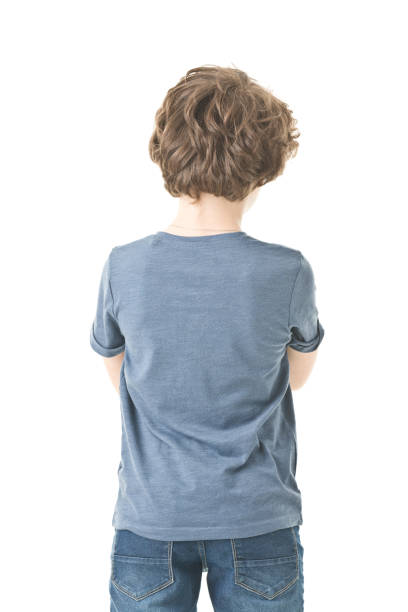 istock back of 9 years old boy isolated on white 1208865265
