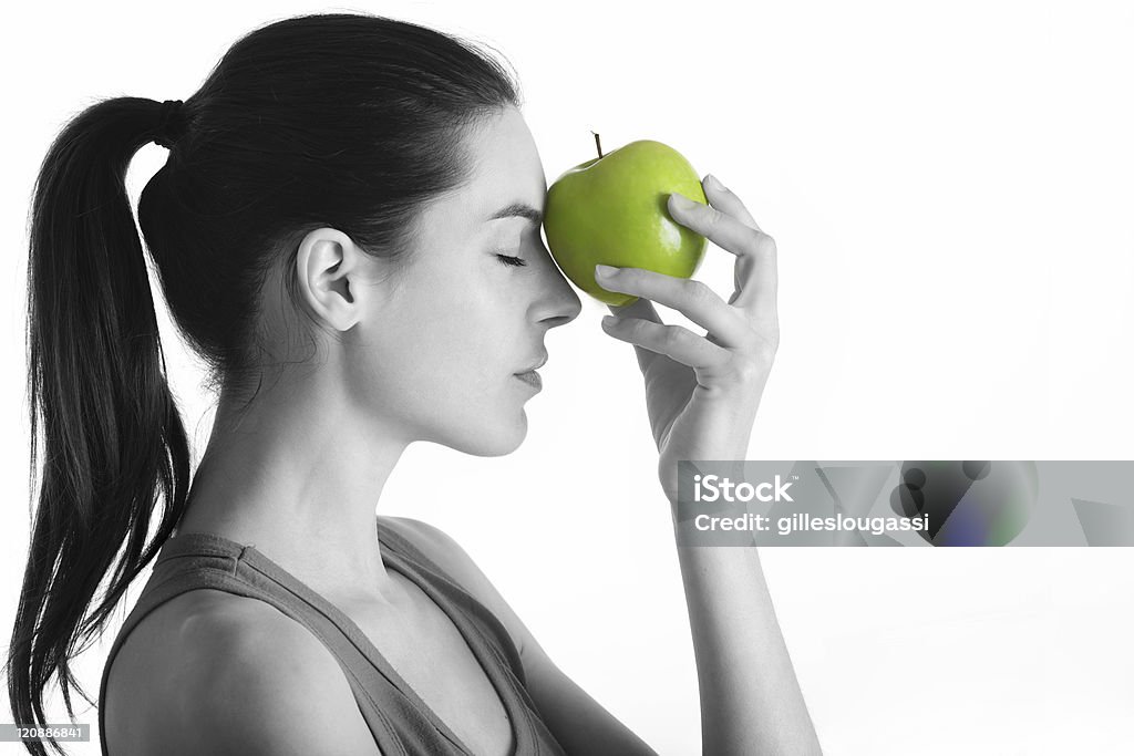 black and white portrait black and white portrait with green apple Adult Stock Photo