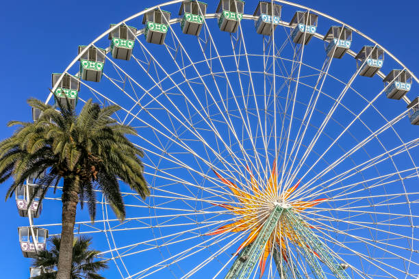 istock Colourful ferris wheel with a beautiful blue sky 1208872062