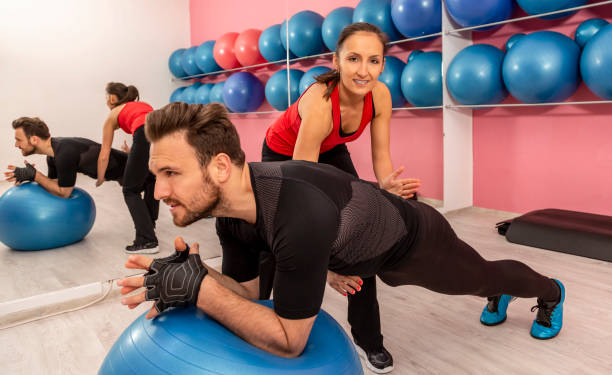 istock Couple Training in a Gym 1208875889