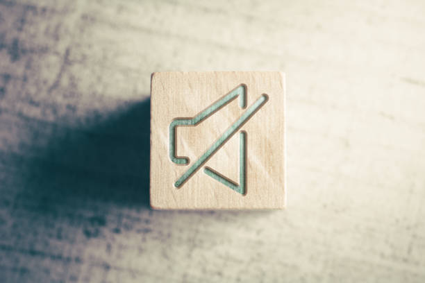 Volume Mute Icon On A Wooden Block On A Table stock photo