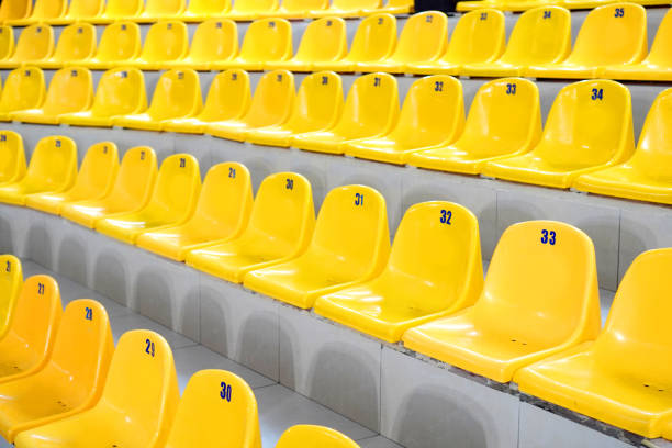 istock Empty yellow stadium stands with no people 1208876994