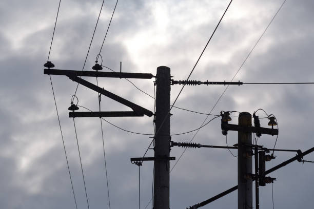 istock High voltage line and cloudy blue sky background 1208877477