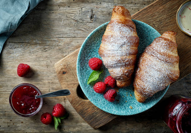 istock sweet croissants and berries 1208878048