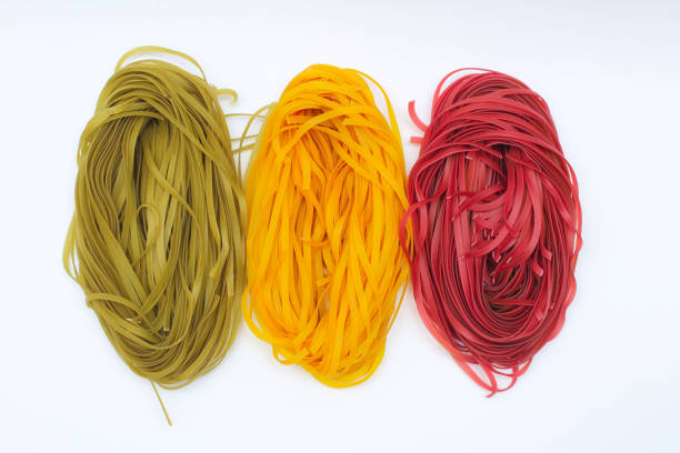 istock Isolated colored spaghetti nests on a white background 1208878658