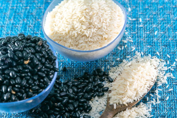 istock Rice and bean grains arranged in small bowls 1208879866