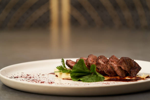istock Filet mignon with mashed potatoes and pomegranate sauce, close-up 1208880548