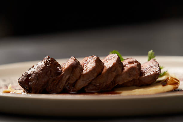 istock Filet mignon with mashed potatoes and pomegranate sauce, close-up 1208880558