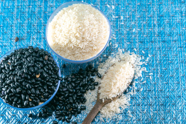 Uncooked rice and black beans background