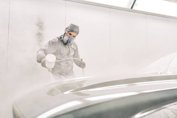 istock A man painting a car 1208883752