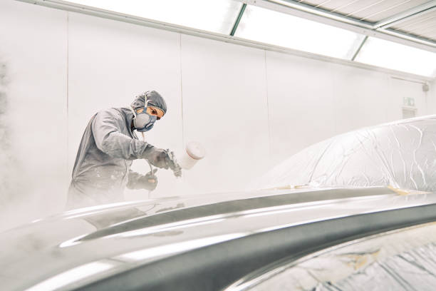 istock A man painting a car 1208883761