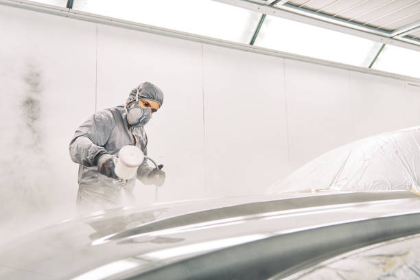 istock A man painting a car 1208883770